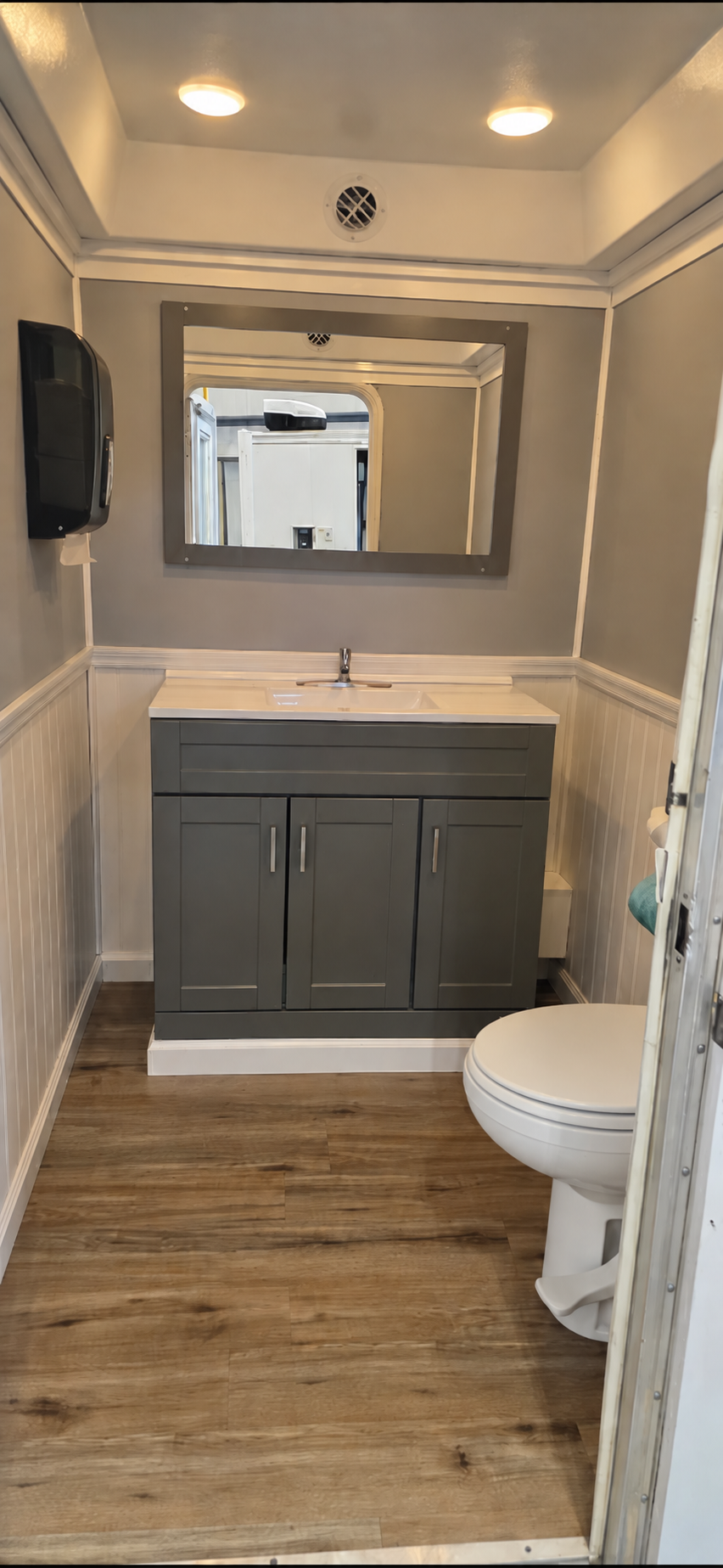 Coastal Throne Co. Acadia flagship luxury restroom trailer interior with premium finishes