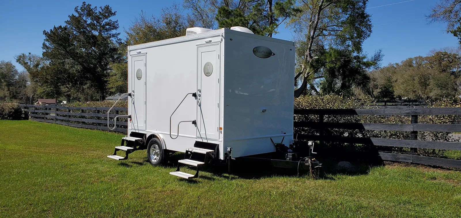 Coastal Throne Co. luxury restroom trailer at Maine barn wedding venue
